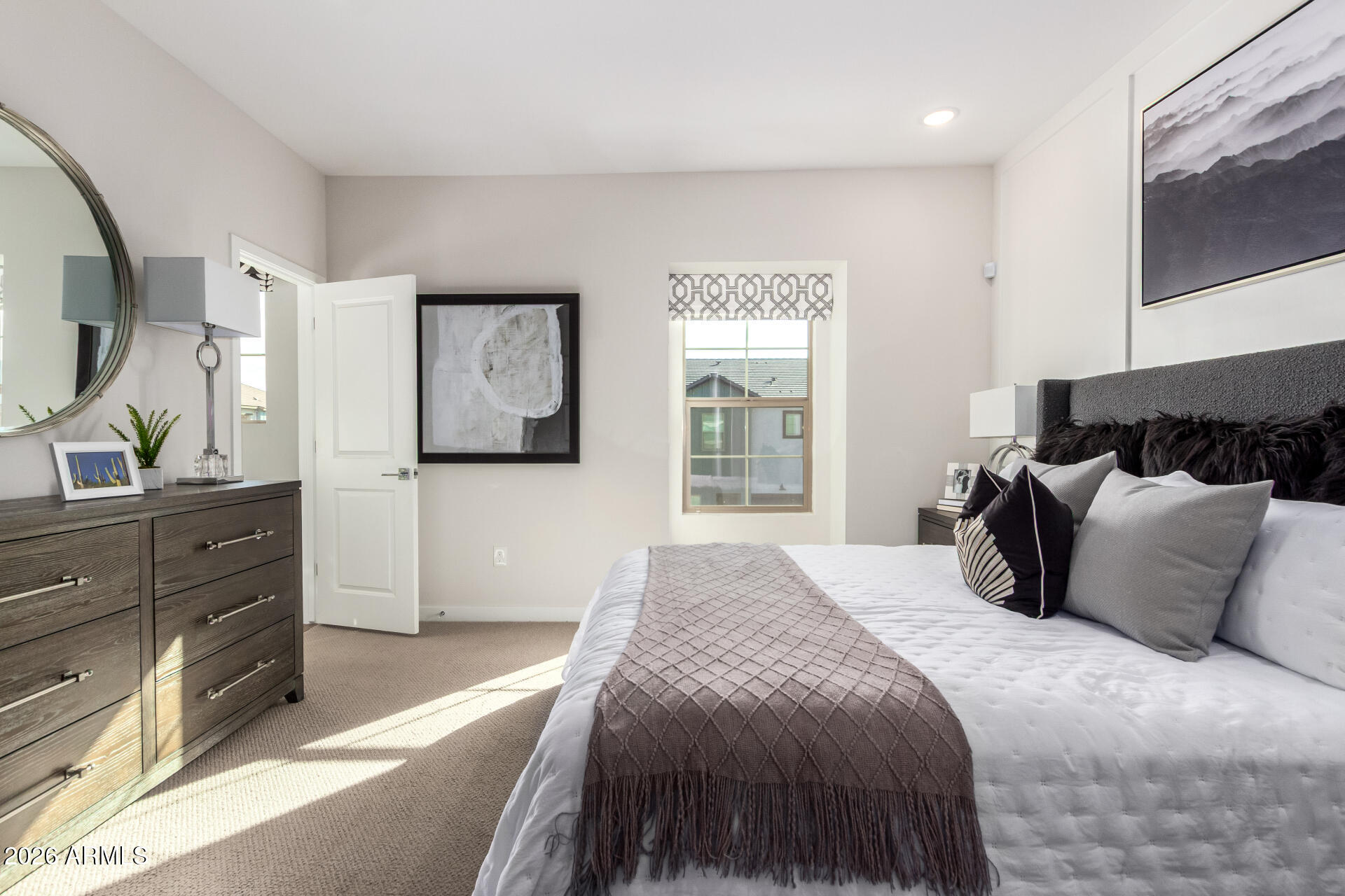 7576 West Darrow Street Laveen, AZ 85339 - Photo 15 of 44 a bedroom with a large bed and a dresser