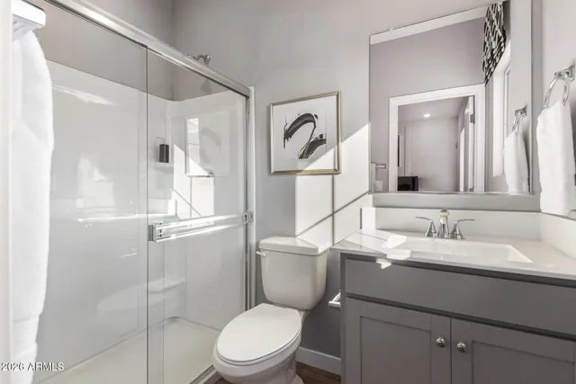 a view of a patio with couches table and chairs and potted plants