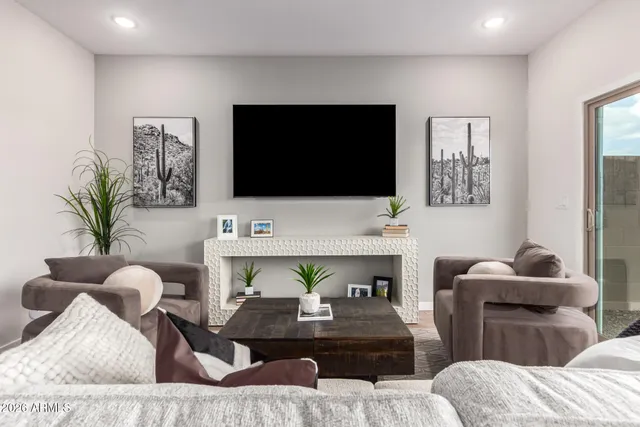 a living room with furniture fireplace and a flat screen tv