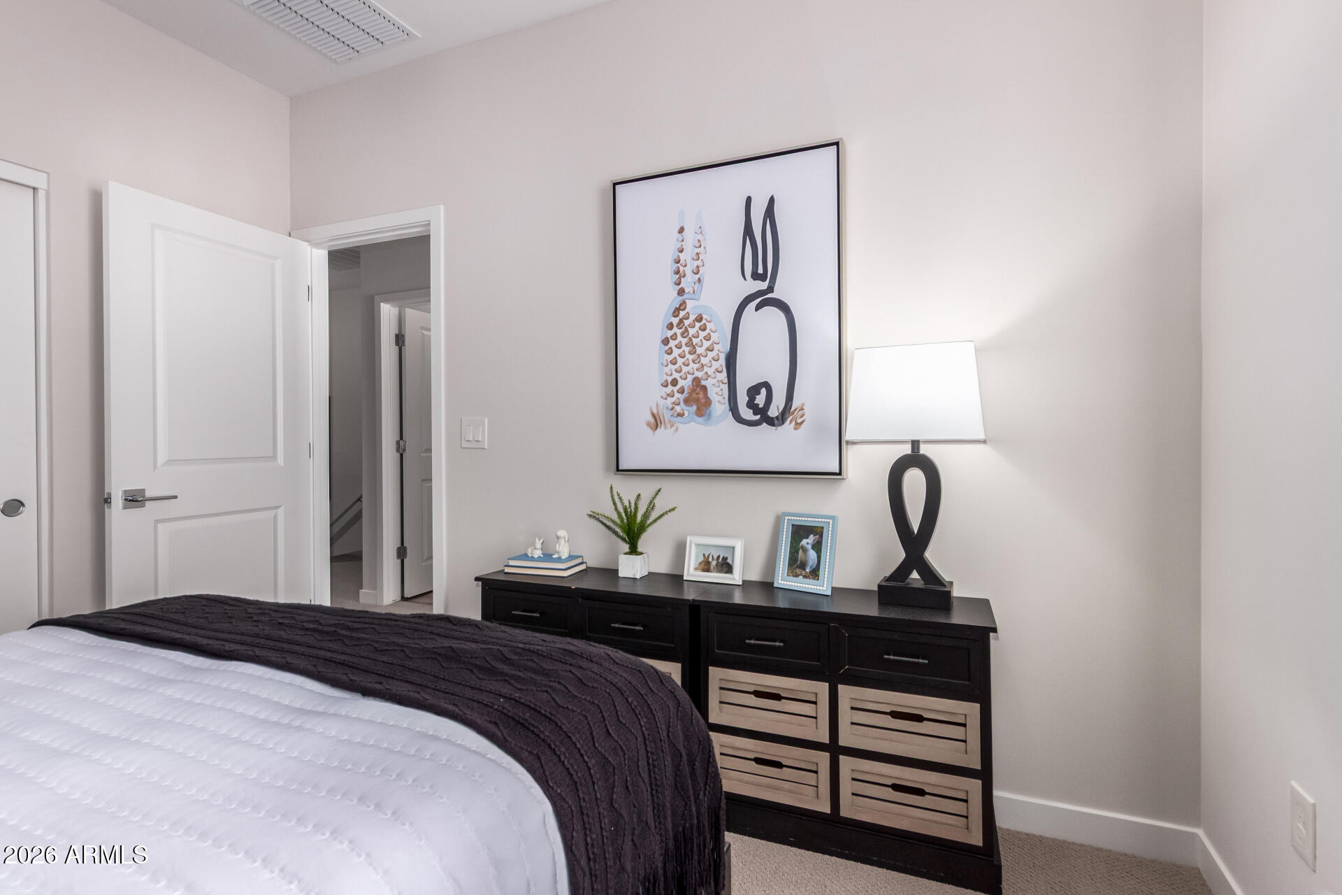 7576 West Darrow Street Laveen, AZ 85339 - Photo 21 of 44 a bedroom with a bed and painting on the wall