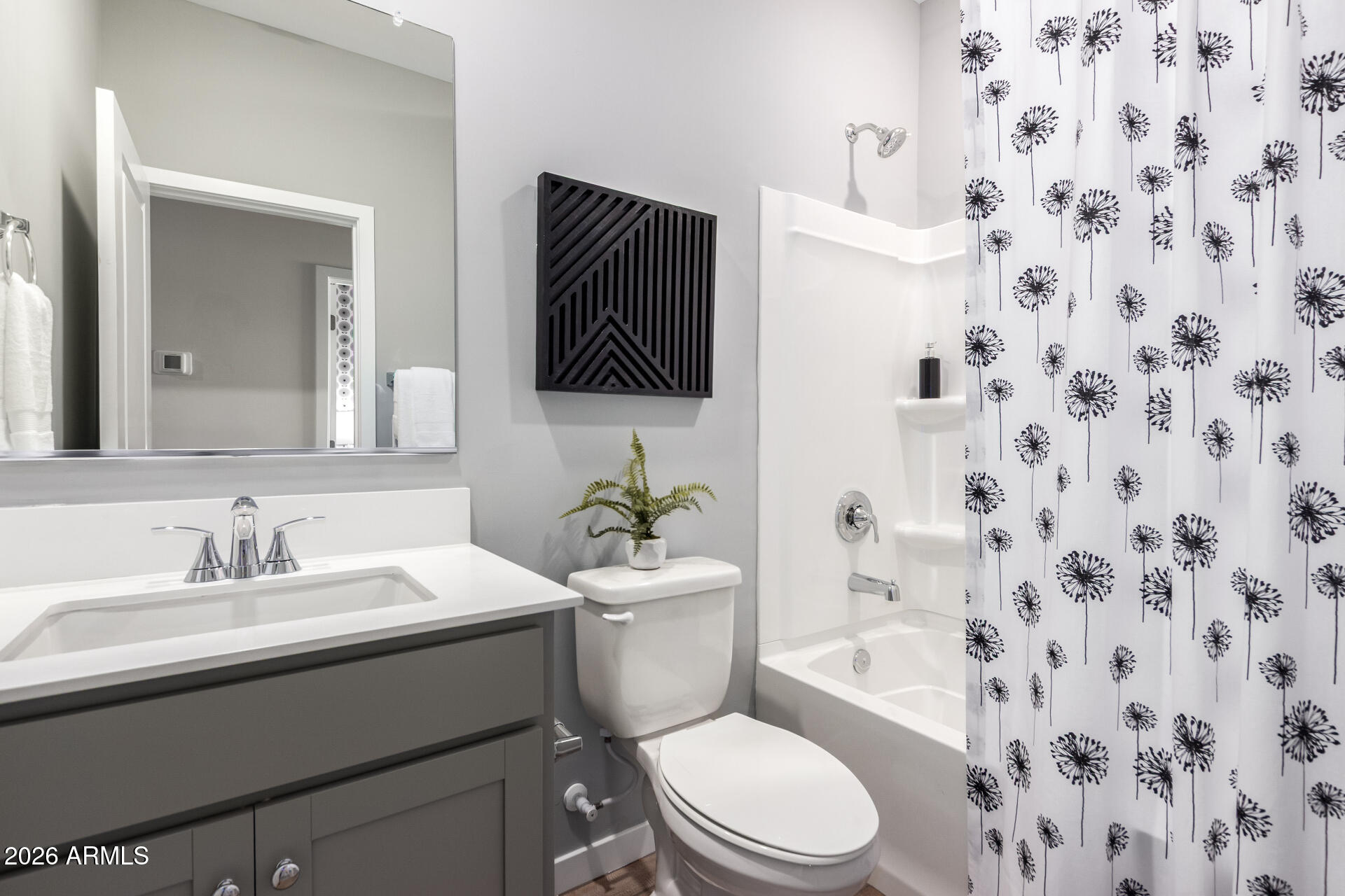 7576 West Darrow Street Laveen, AZ 85339 - Photo 23 of 44 a bathroom with a sink toilet a mirror and shower