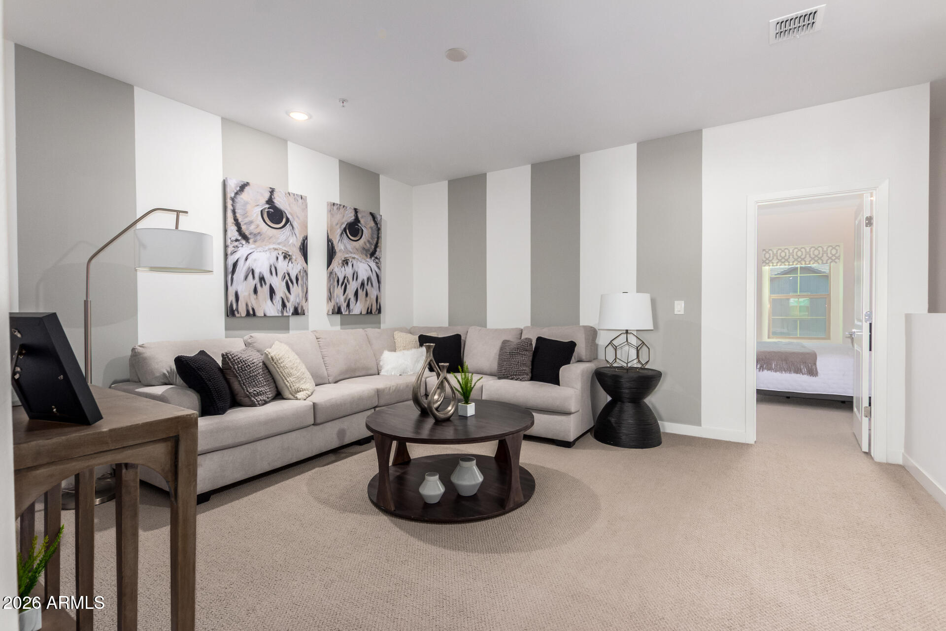 7576 West Darrow Street Laveen, AZ 85339 - Photo 25 of 44 a living room with furniture and a flat screen tv