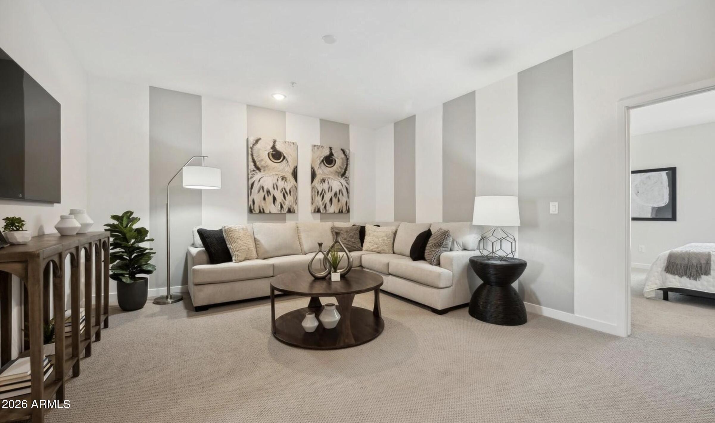 7576 West Darrow Street Laveen, AZ 85339 - Photo 28 of 44 a living room with furniture and a flat screen tv