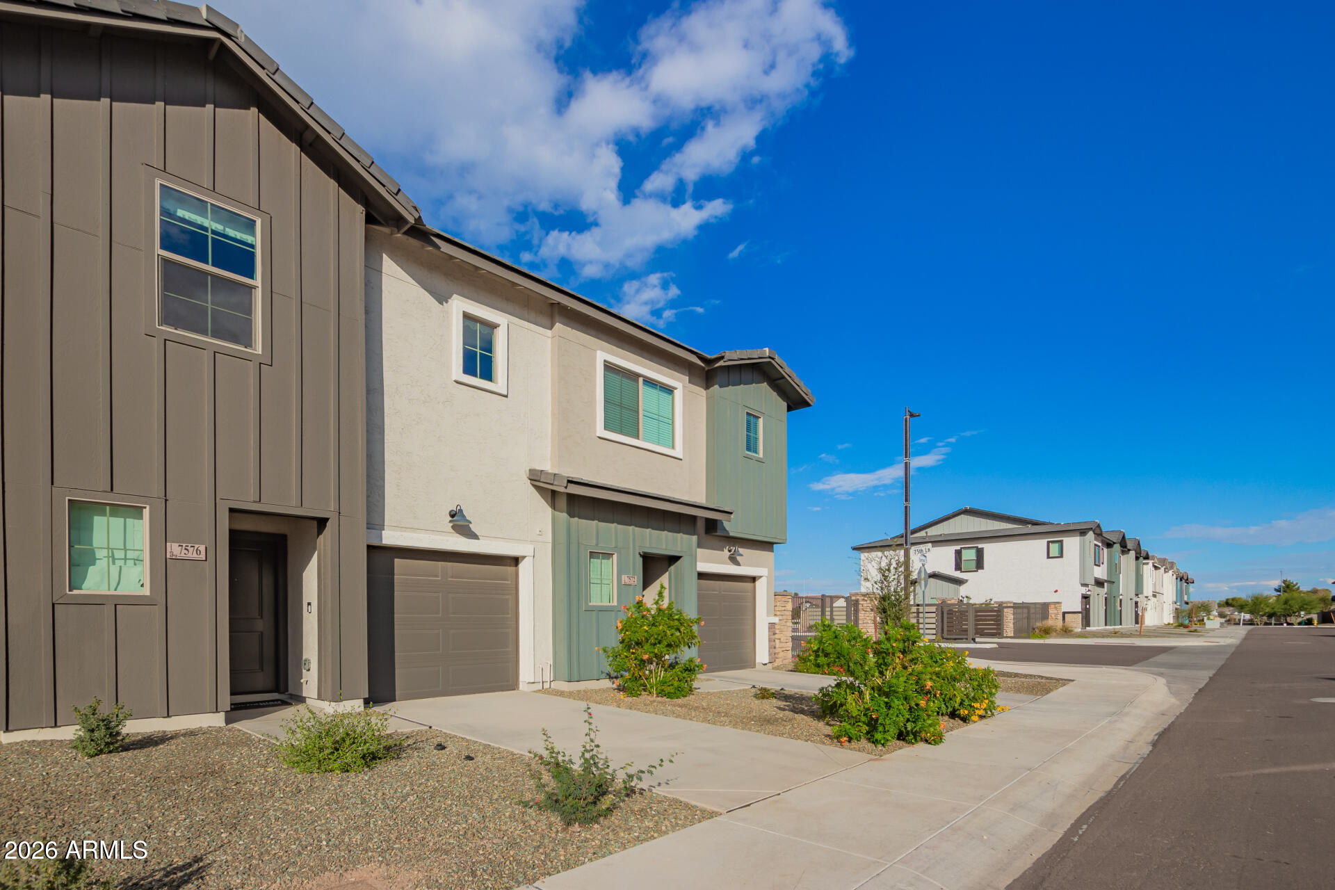 7576 West Darrow Street Laveen, AZ 85339 - Photo 42 of 44 a front view of a house with garden