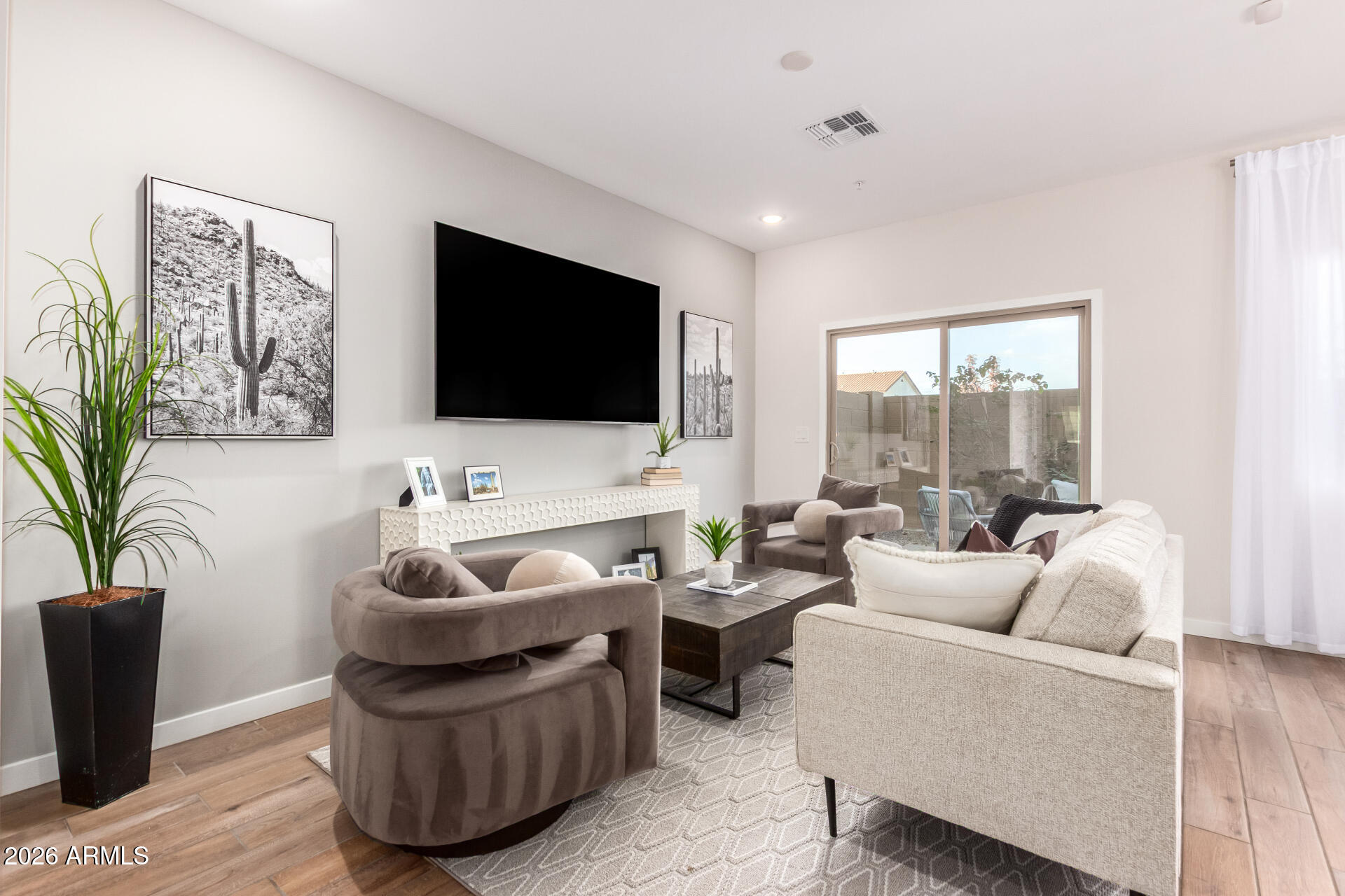 7576 West Darrow Street Laveen, AZ 85339 - Photo 7 of 44 a living room with furniture and a flat screen tv