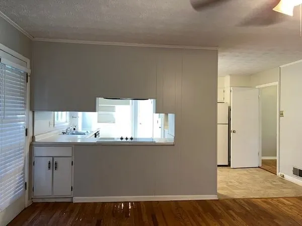 a room with a sink and a mirror