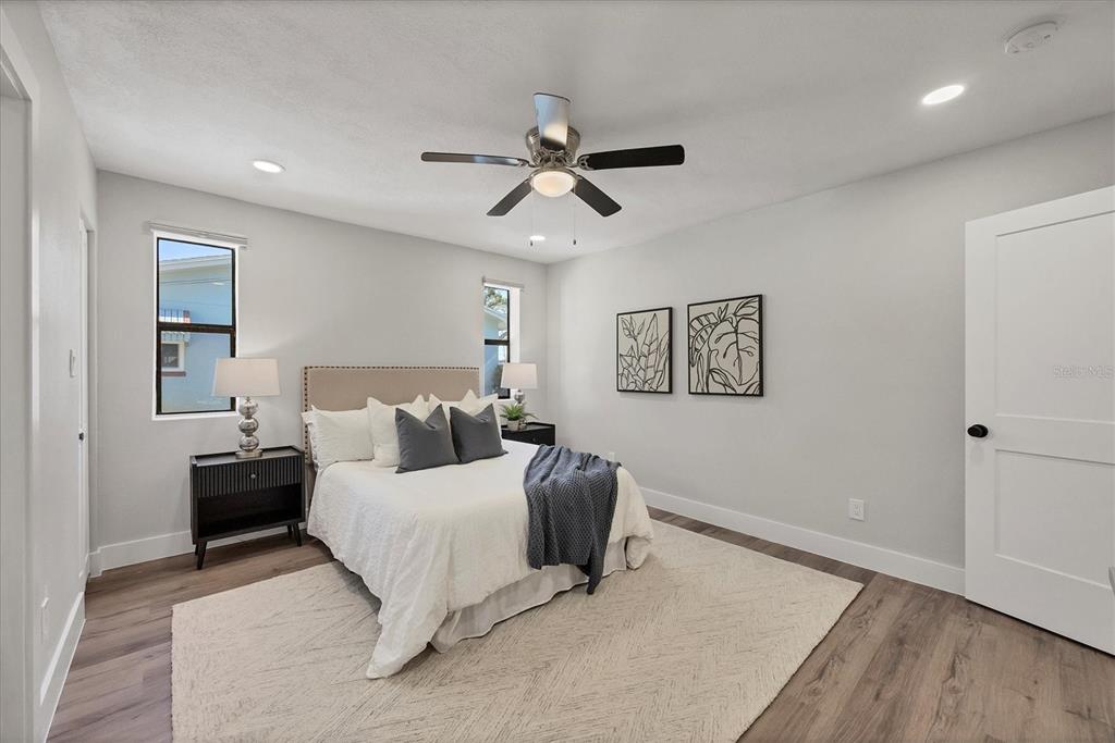 4737 Del Rio Way South Gulfport, FL 33711 - Photo 18 of 55 a bedroom with a bed and a ceiling fan