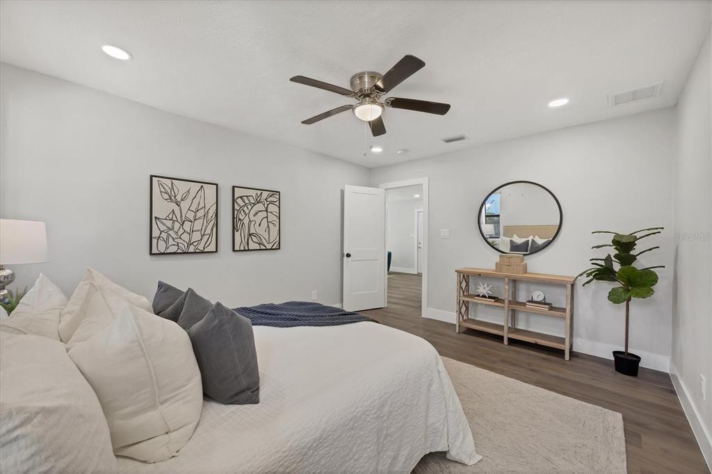 4737 Del Rio Way South Gulfport, FL 33711 - Photo 19 of 55 a bed room with a bed and a chandelier