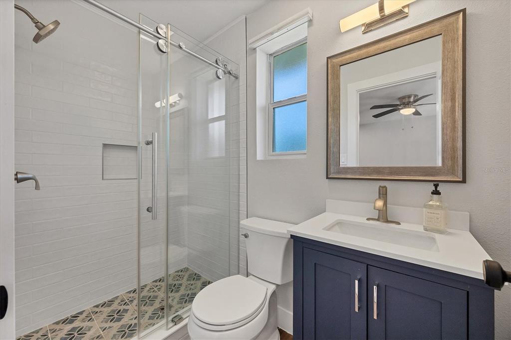 4737 Del Rio Way South Gulfport, FL 33711 - Photo 20 of 55 a bathroom with a sink a toilet and shower