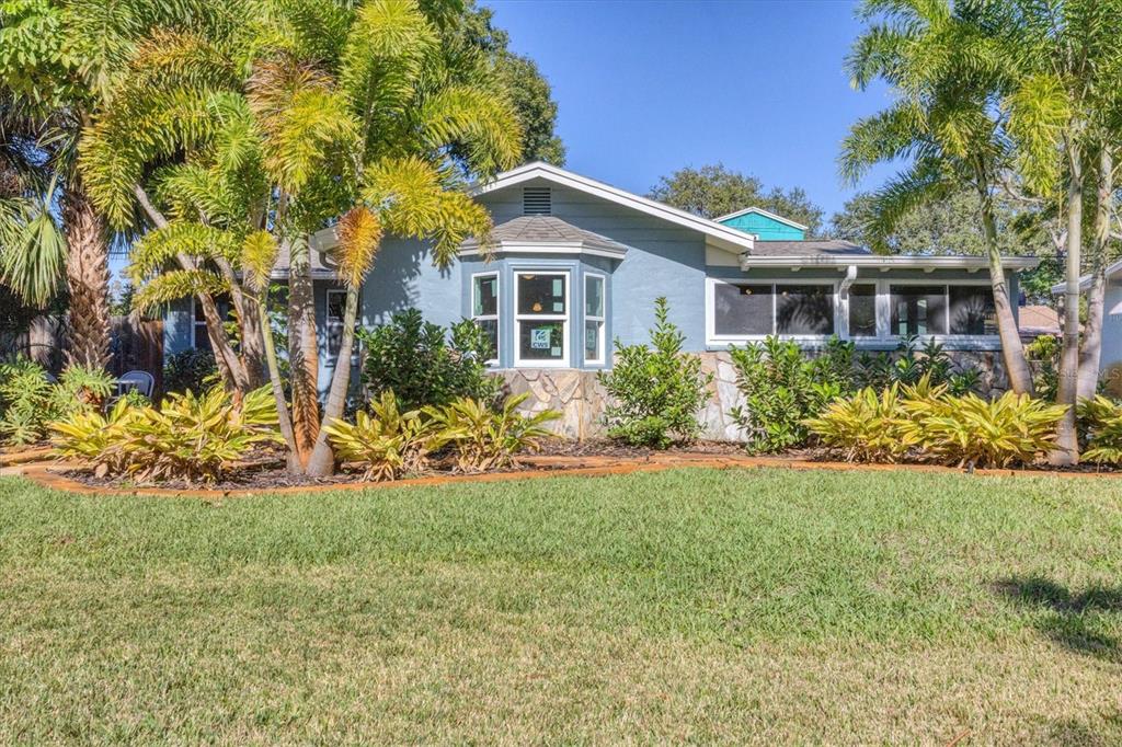 4737 Del Rio Way South Gulfport, FL 33711 - Photo 2 of 55 a front view of house with yard and green space