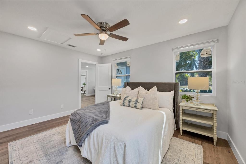 4737 Del Rio Way South Gulfport, FL 33711 - Photo 22 of 55 a bedroom with a bed and a chandelier