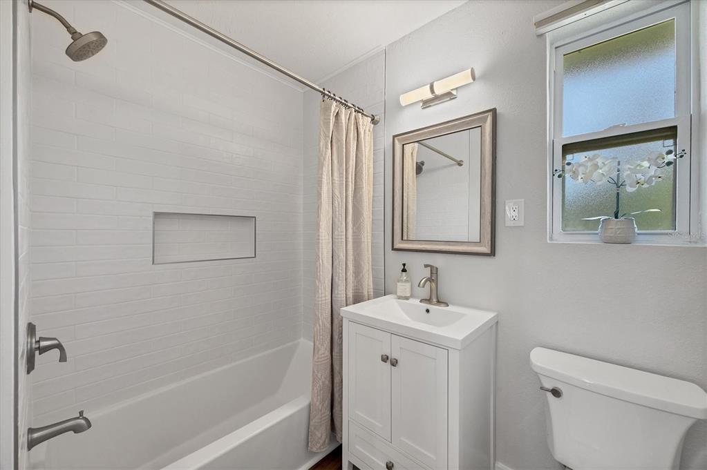 4737 Del Rio Way South Gulfport, FL 33711 - Photo 23 of 55 a bathroom with a granite countertop sink toilet and shower