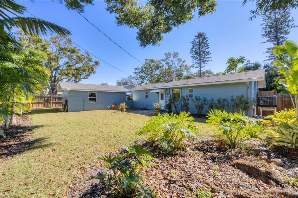 4737 Del Rio Way South Gulfport, FL 33711 - Photo 25 of 55 a front view of a house with a yard and a garden