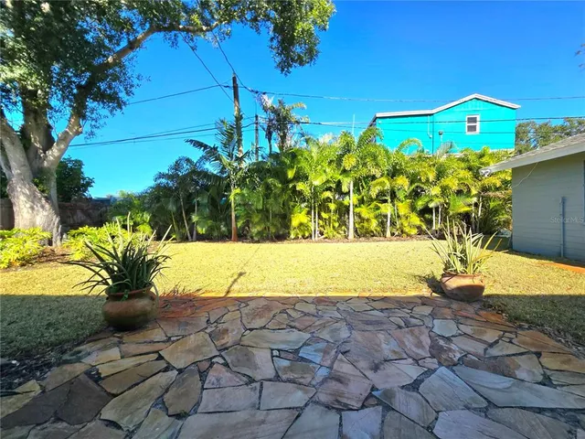 a view of a yard with an umbrella