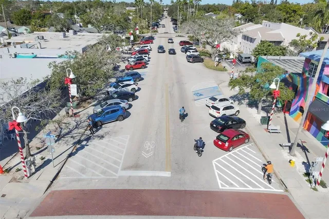 a view of backyard with plants and outdoor seating
