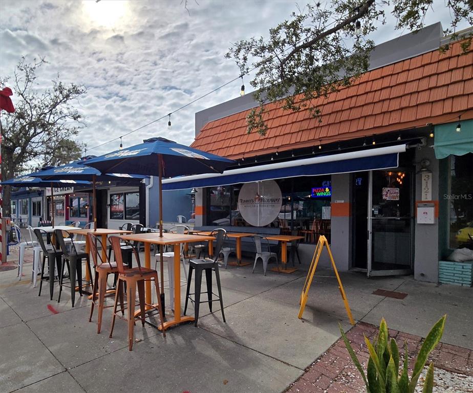 4737 Del Rio Way South Gulfport, FL 33711 - Photo 47 of 55 a view of people sitting in front of retail shop