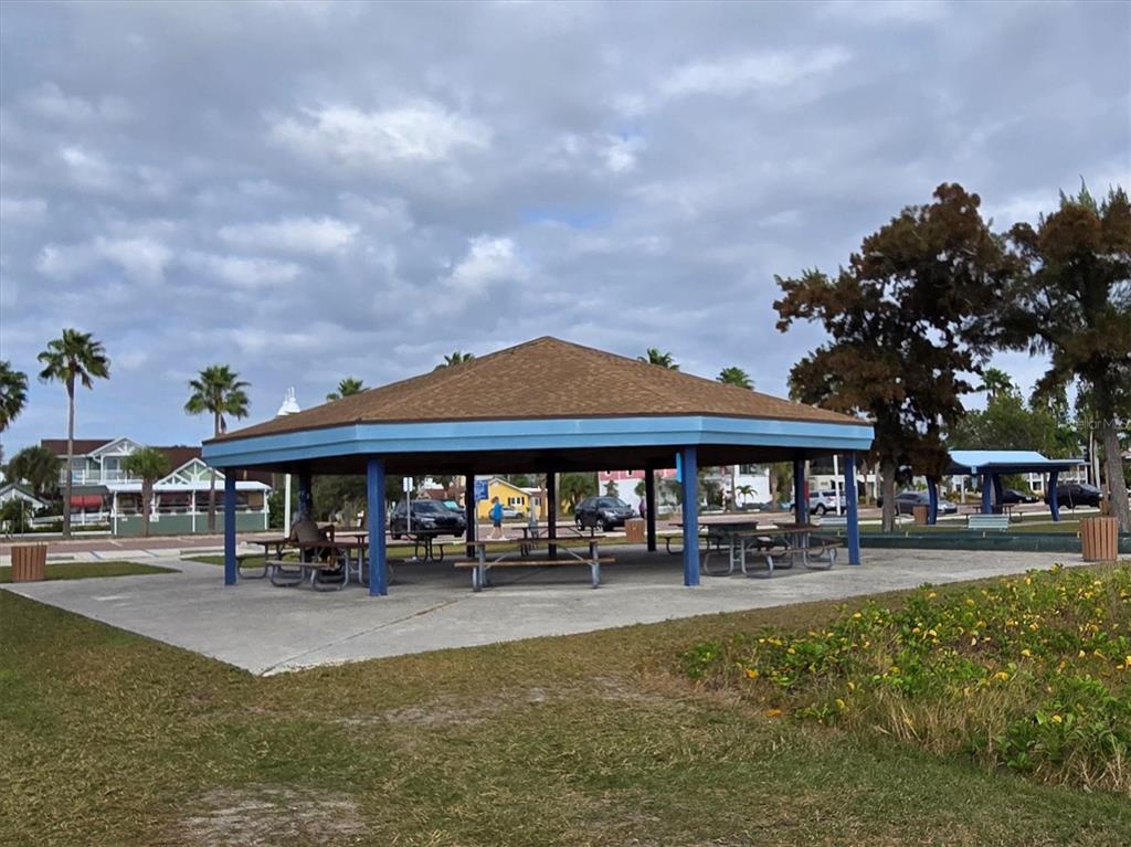 4737 Del Rio Way South Gulfport, FL 33711 - Photo 53 of 55 a front view of a building with lots of trees and barbeque oven