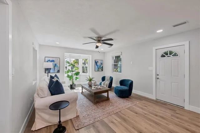 a living room with furniture and a window