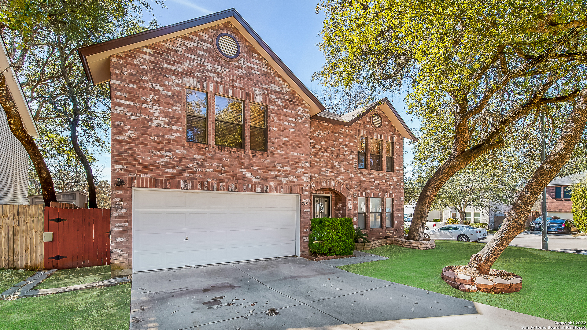 9294 Ridge Path San Antonio, TX 78250 - Photo 1 of 1 a front view of a house with a garden