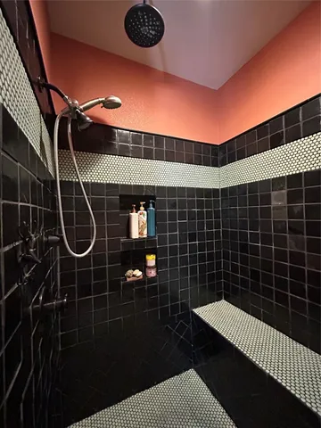 a bathroom with a double vanity sink and mirror