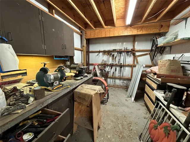 a front view of house with yard outdoor seating and barbeque oven