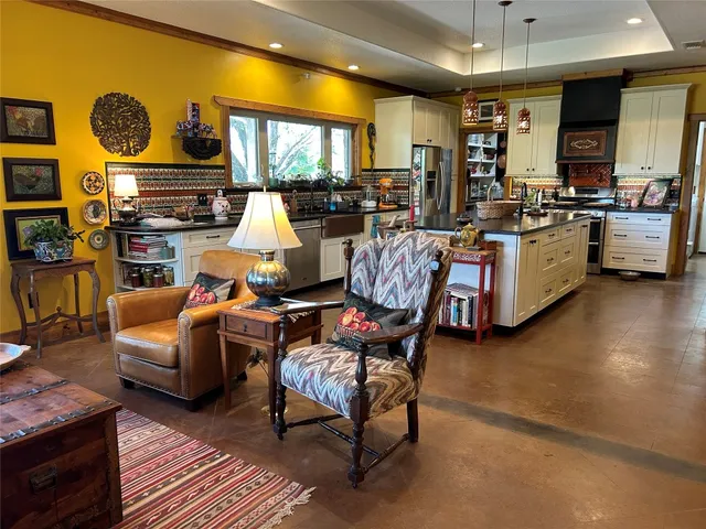 a kitchen with stainless steel appliances granite countertop a stove and a sink