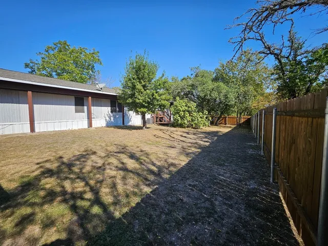 a view of a backyard of the house