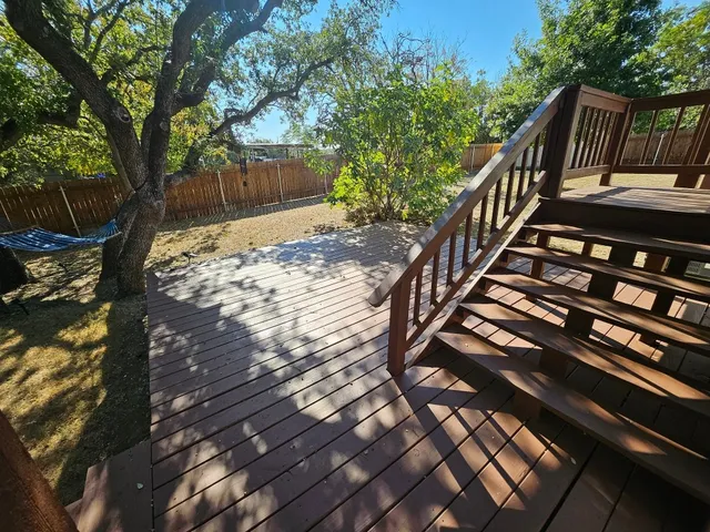 a view of stairs and wooden floor