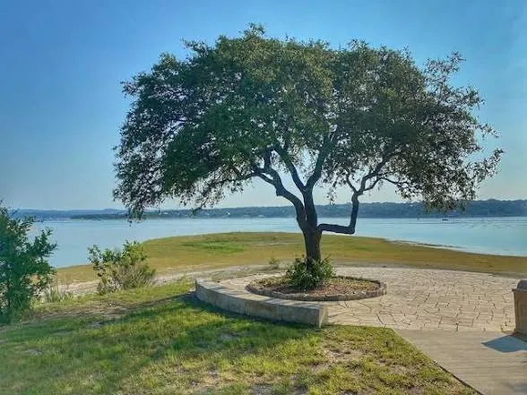 a view of a lake with a yard