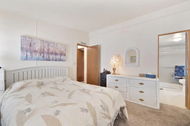 a view of a pathway of a house with wooden fence