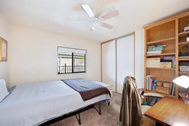 a view of a swimming pool with chairs