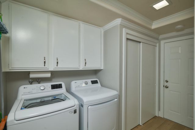 a view of storage and utility room with washer and dryer