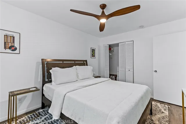 a bedroom with a large bed and a window