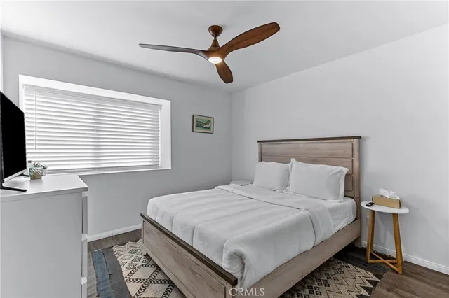 a bathroom with a sink a toilet and a shower curtain
