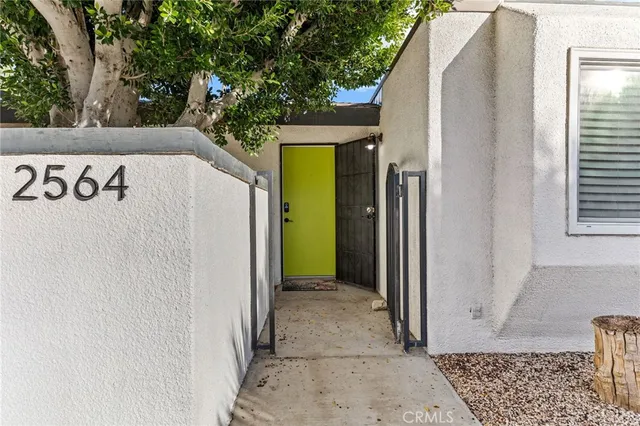 a living room with fireplace furniture and a flat screen tv