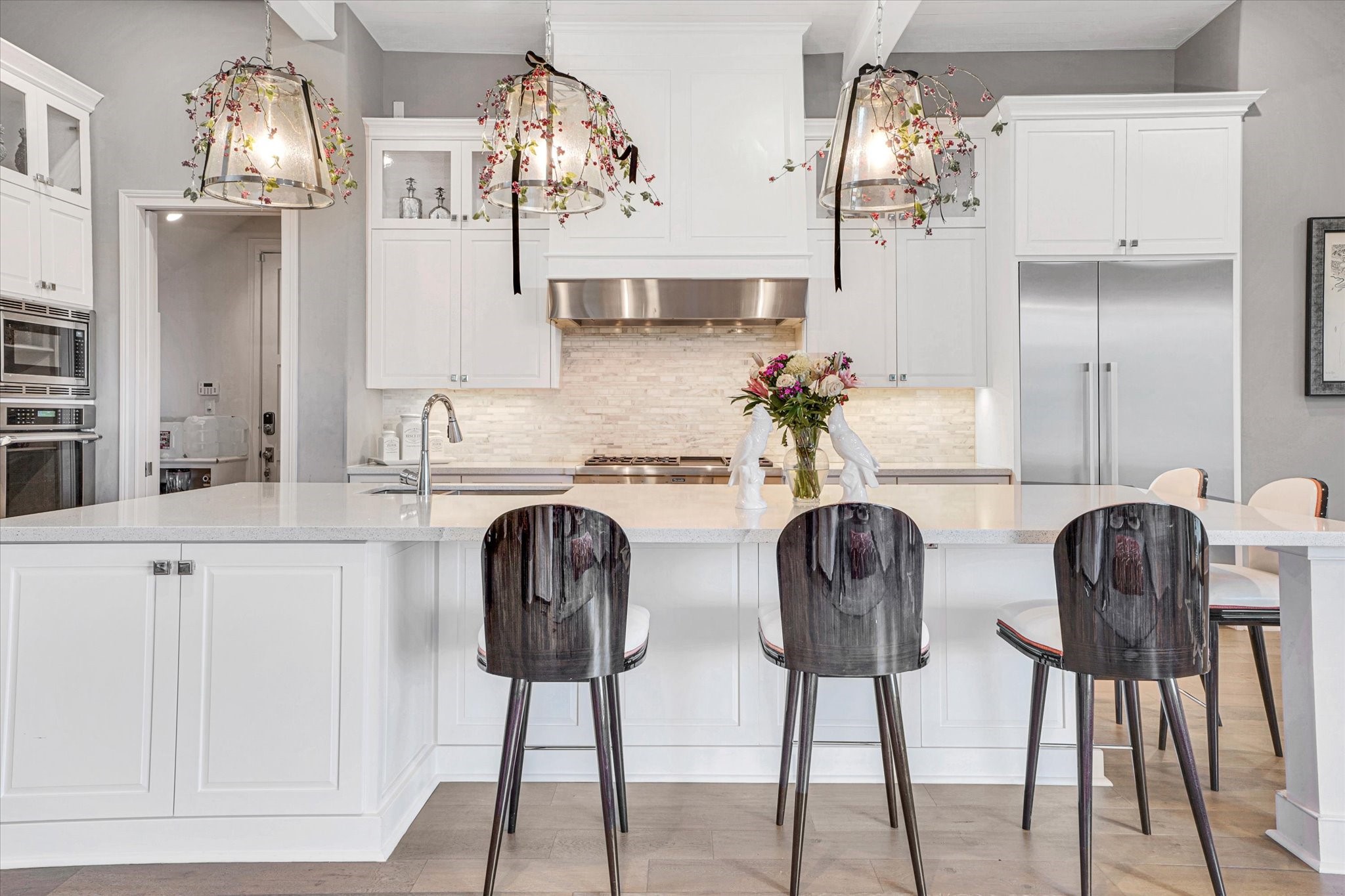 42 Pronghorn Place Spring, TX 77389 - Photo 14 of 47 a kitchen with stainless steel appliances a dining table chairs and chandelier