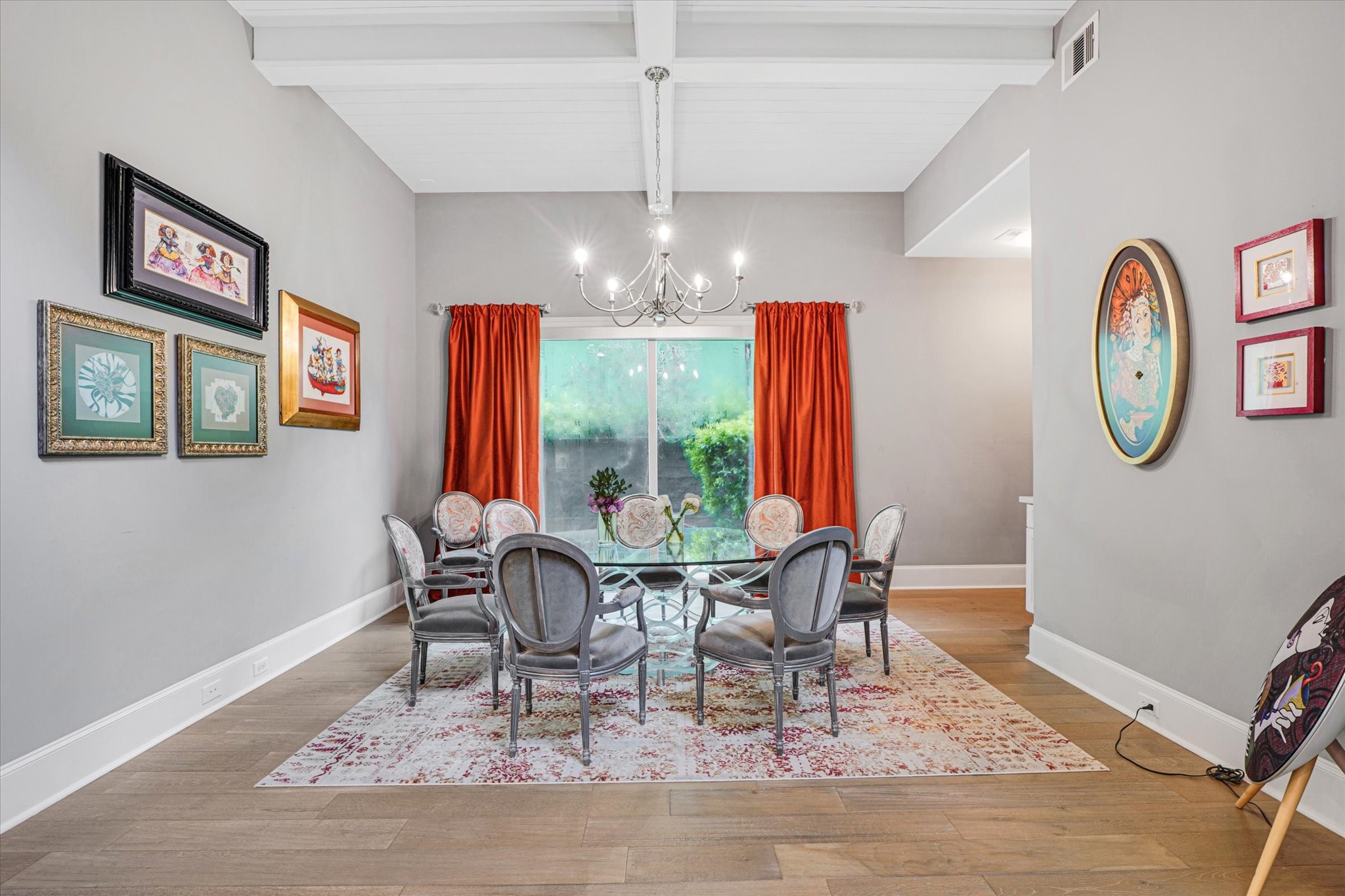 42 Pronghorn Place Spring, TX 77389 - Photo 6 of 47 a dining room with wooden floor a chandelier a wooden table and chairs
