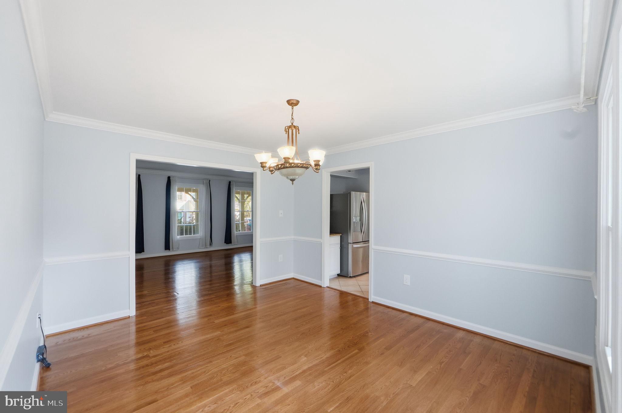 7504 Mullingar Court Springfield, VA 22153 - Photo 11 of 60 wooden floor in an empty room with a window