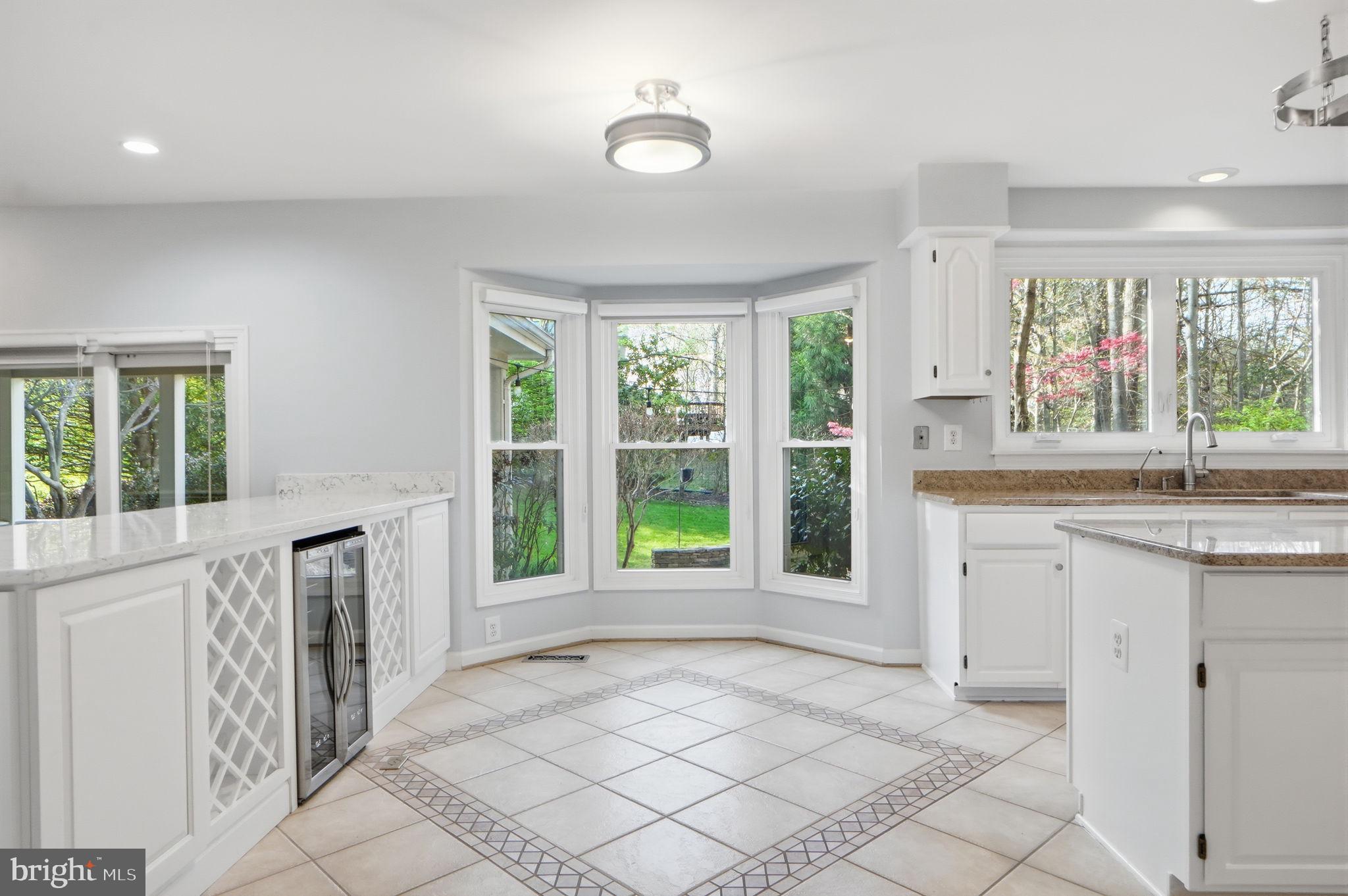 7504 Mullingar Court Springfield, VA 22153 - Photo 15 of 60 a view of a kitchen with a sink and a large window