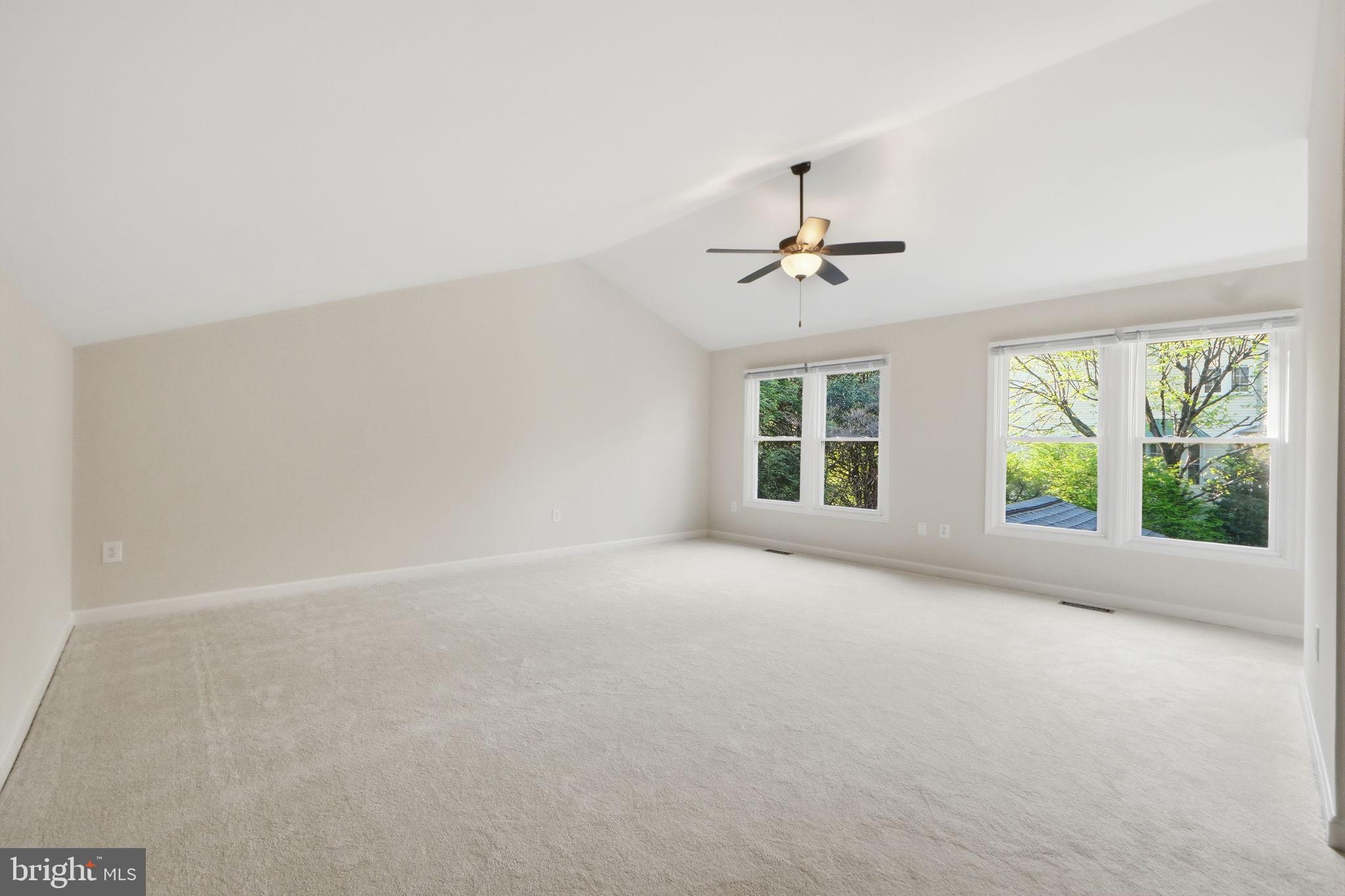 7504 Mullingar Court Springfield, VA 22153 - Photo 24 of 60 en empty room with windows and ceiling fan