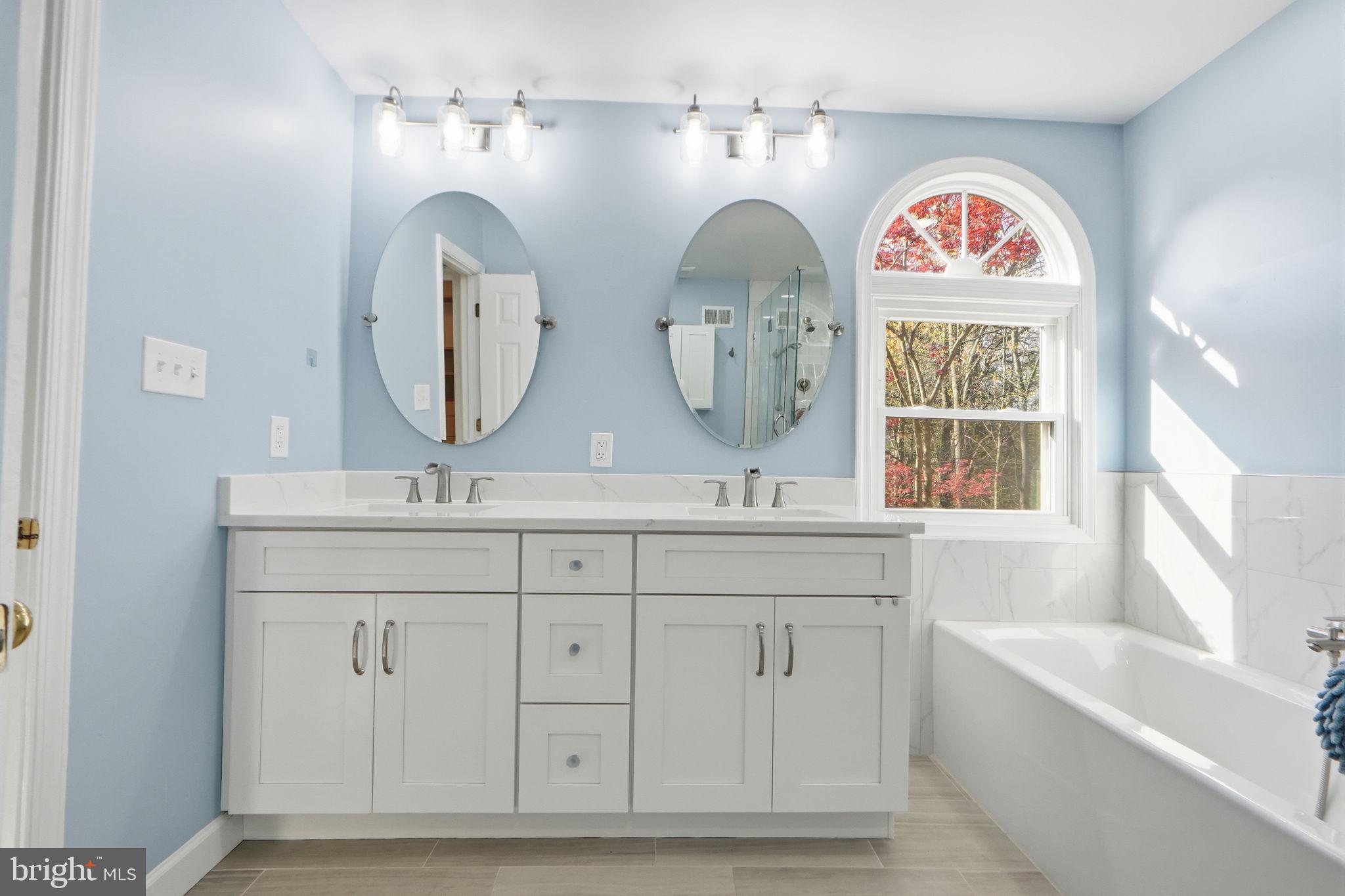 7504 Mullingar Court Springfield, VA 22153 - Photo 29 of 60 a bathroom with mirror and
