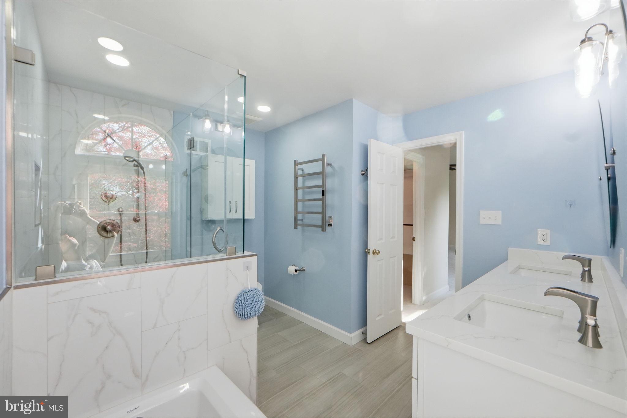 7504 Mullingar Court Springfield, VA 22153 - Photo 30 of 60 a bathroom with a sink a shower and a mirror