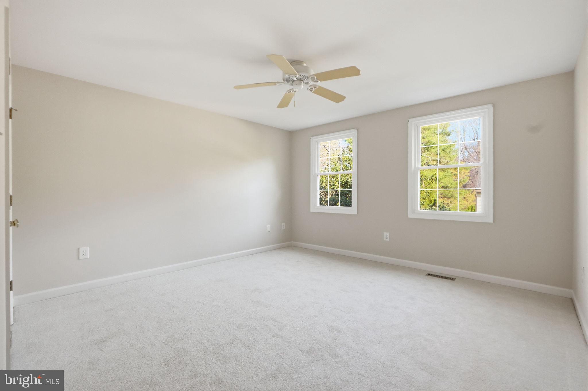 7504 Mullingar Court Springfield, VA 22153 - Photo 32 of 60 an empty room with windows and fan