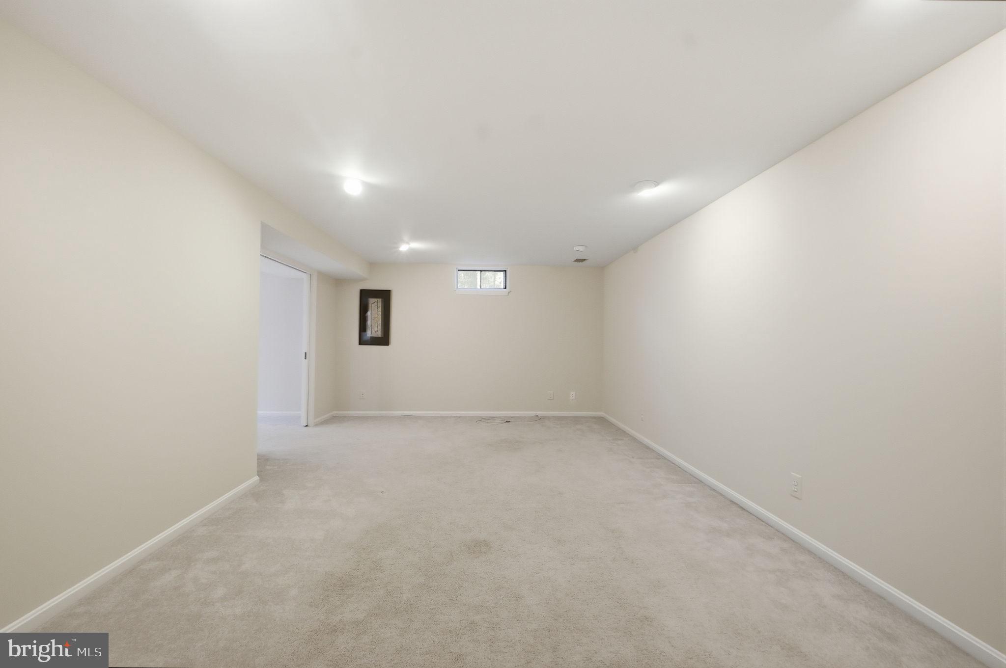 7504 Mullingar Court Springfield, VA 22153 - Photo 42 of 60 an empty room with a empty space and windows