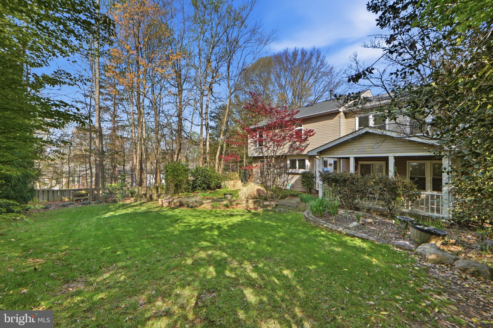 7504 Mullingar Court Springfield, VA 22153 - Photo 55 of 60 a front view of a house with a garden