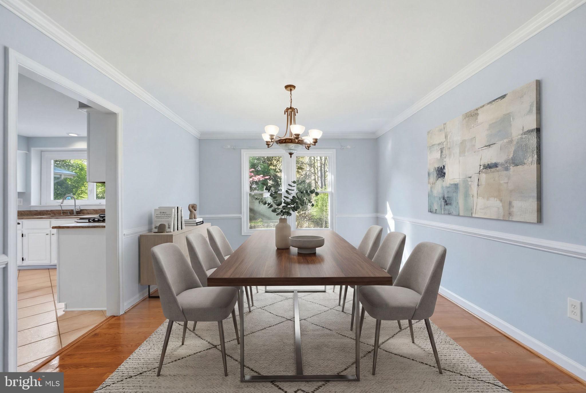 7504 Mullingar Court Springfield, VA 22153 - Photo 10 of 60 a dining room with furniture a large window and potted plants