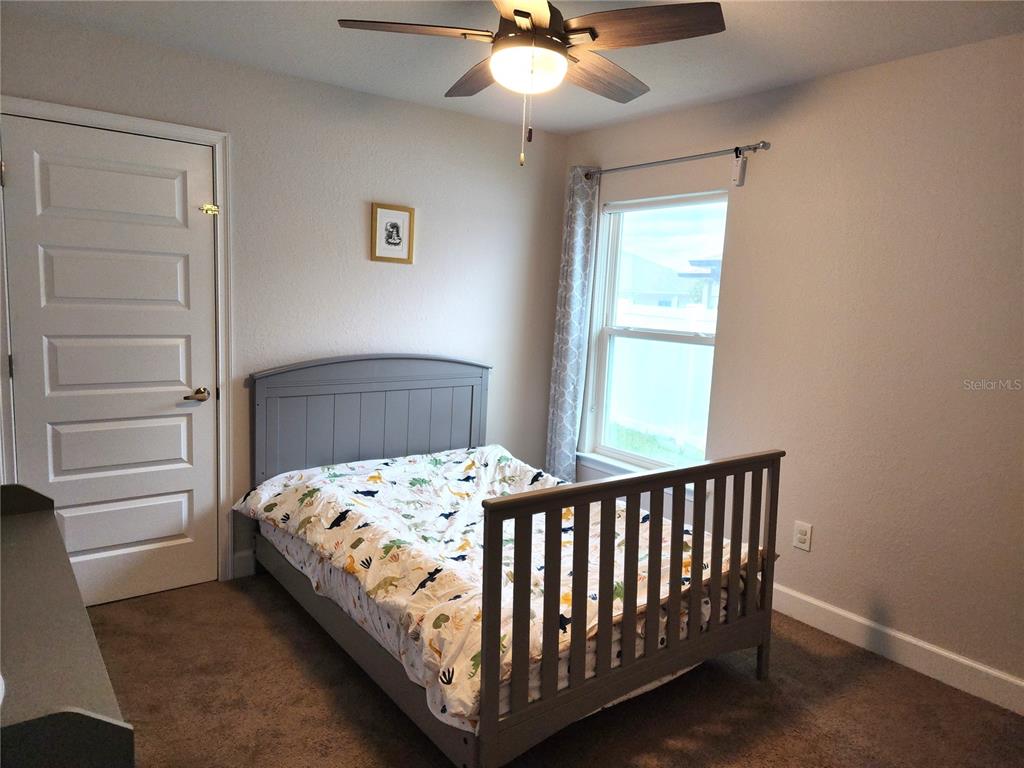 9148 Southeast 49th Avenue Road Ocala, FL 34480 - Photo 14 of 22 a bedroom with a bed and a window