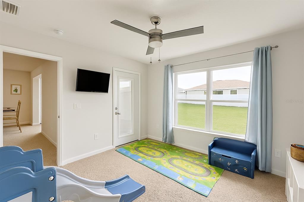 9148 Southeast 49th Avenue Road Ocala, FL 34480 - Photo 15 of 22 a living room with a bed and a window