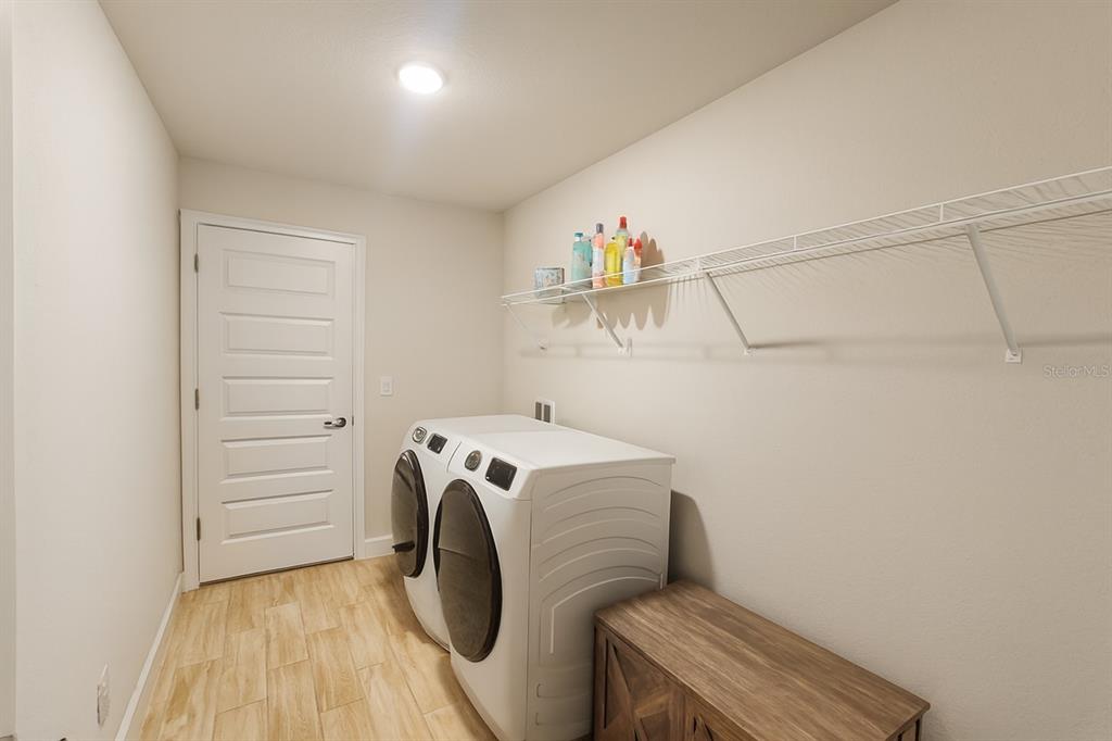 9148 Southeast 49th Avenue Road Ocala, FL 34480 - Photo 18 of 22 a utility room with dryer and washer