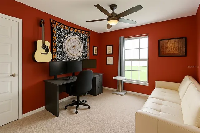 a living room with furniture and a book shelf